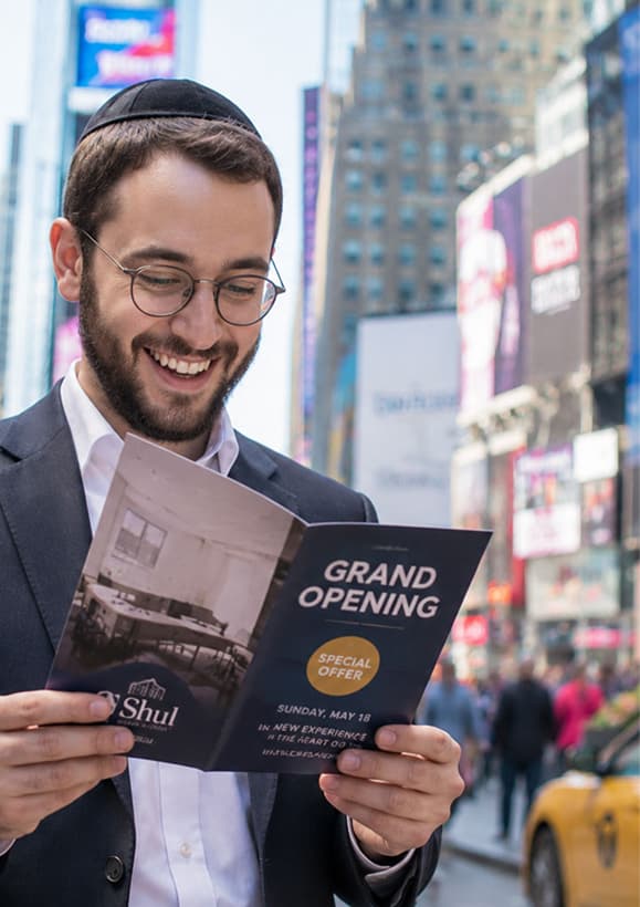 Community member reading a flyer
